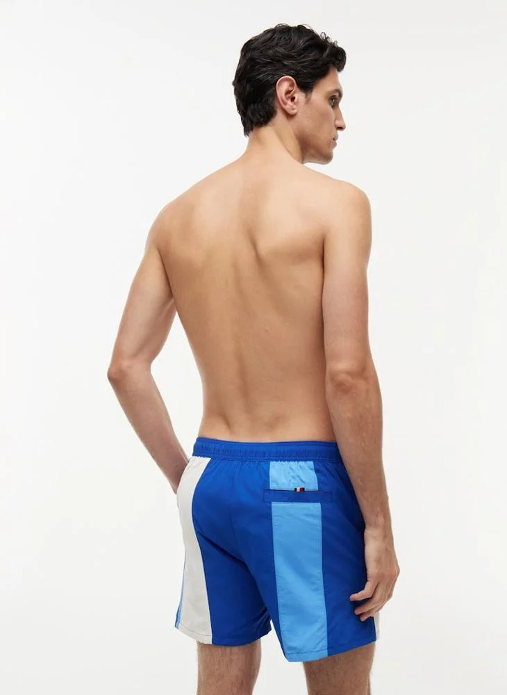 TOMMY HILFIGER  Heritage Colour-Blocked Mid Length Swim Shorts for Men | Best Price UAE